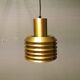 Hanging lamp in gold-colored aluminum with many layers of shades.