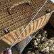 Antique wicker basket with closure and handle
