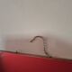 vintage rectangular mirror with broken barber-style chain