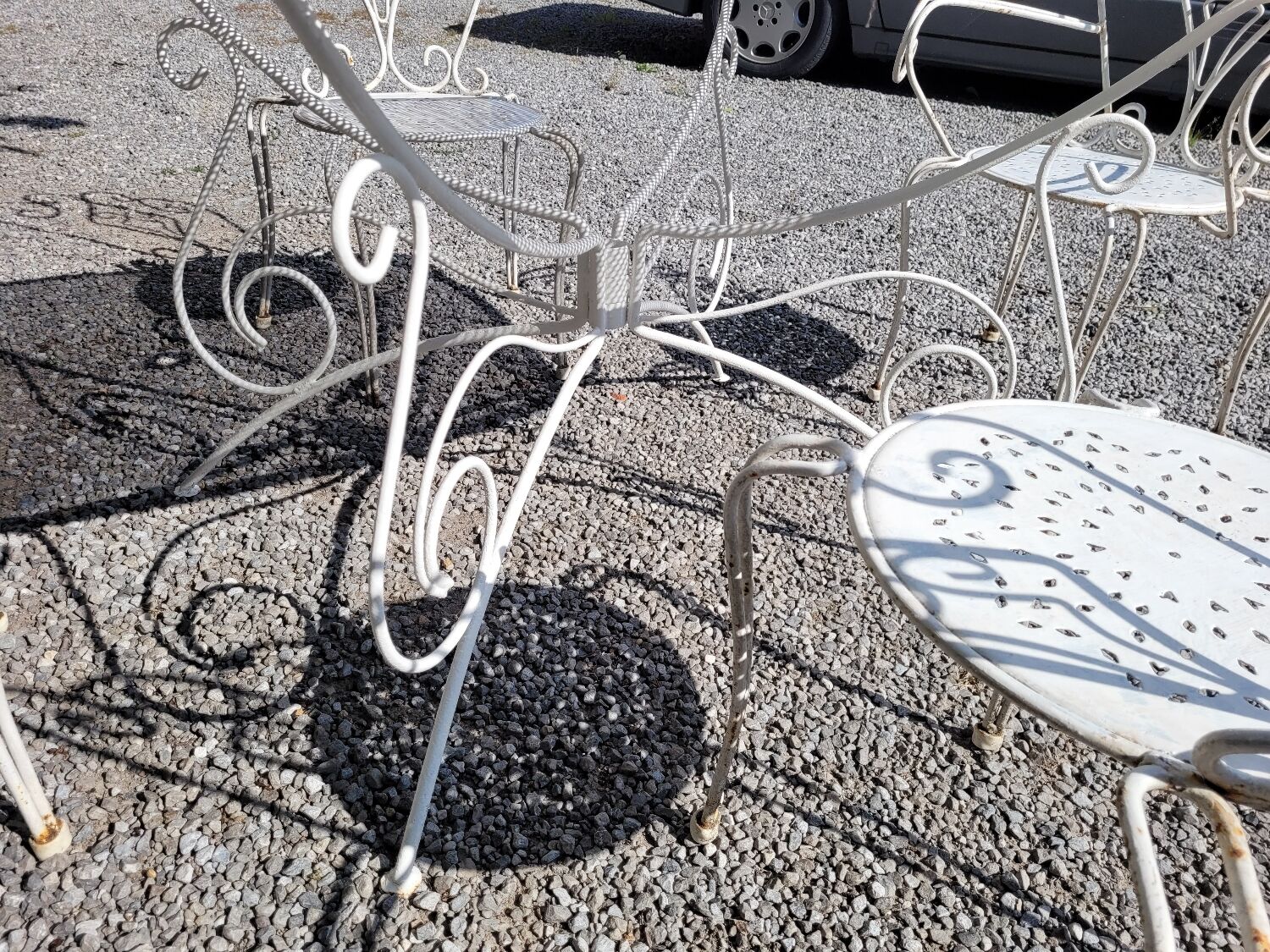 Old wrought iron garden furniture, table + 2 armchairs + 2 chairs