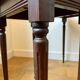 Dark wood and black leather tables