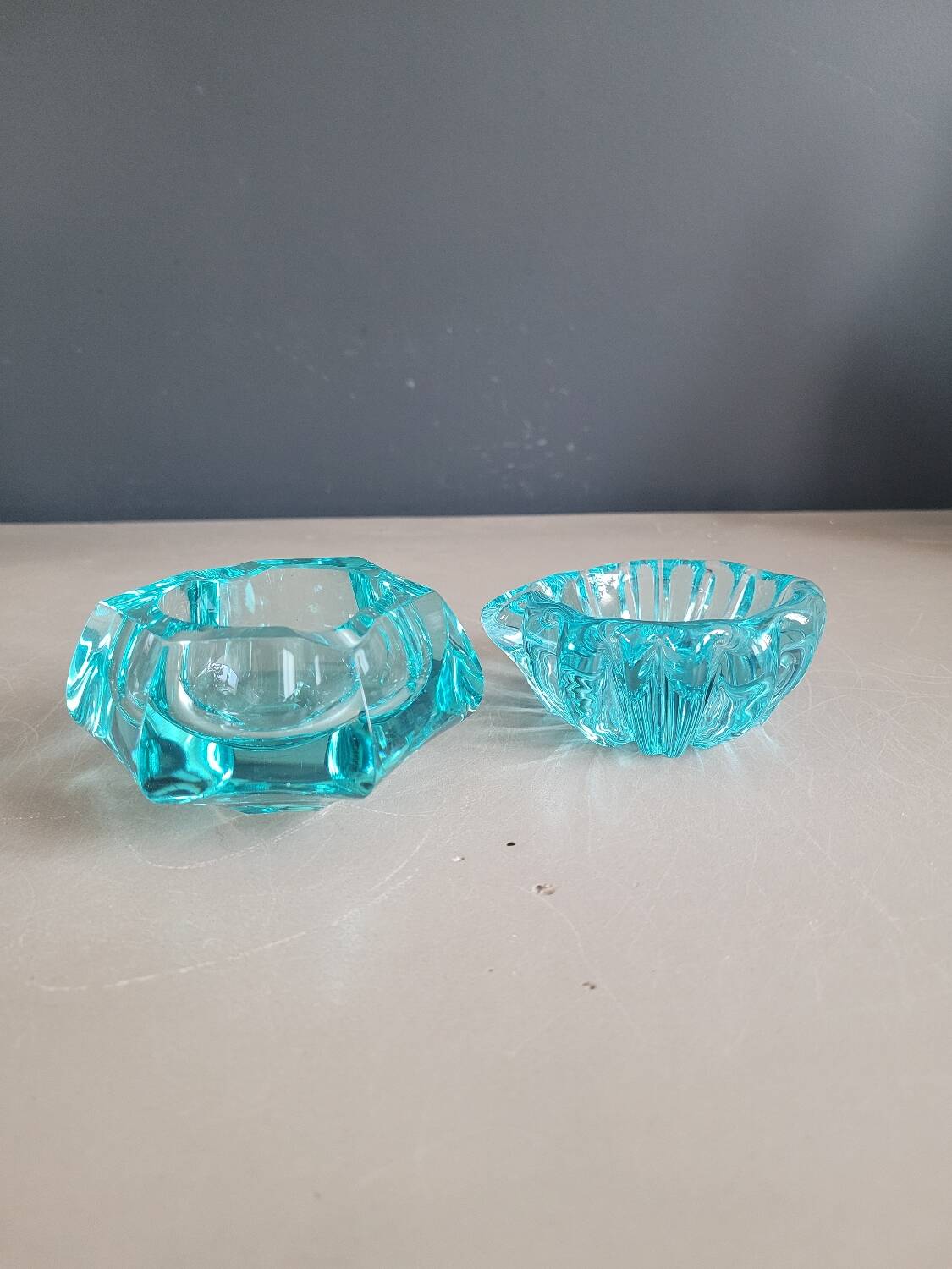Set of 2 assorted turquoise glass ashtrays