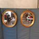 Pair of golden oval mirrors