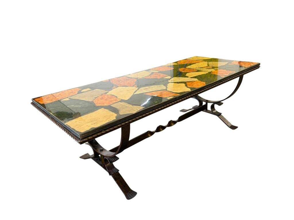 Vintage stone coffee table with a cast iron frame.