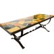 Vintage stone coffee table with a cast iron frame.