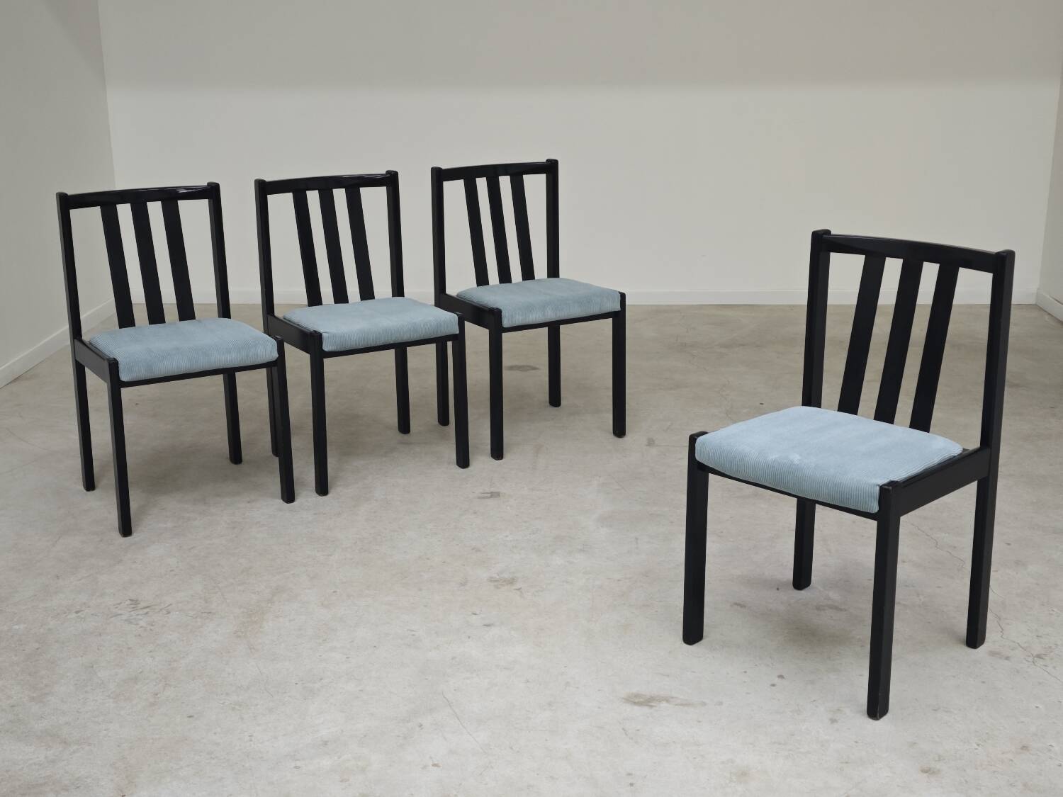 Set of 4 modernist black chairs with light blue ribbed fabric