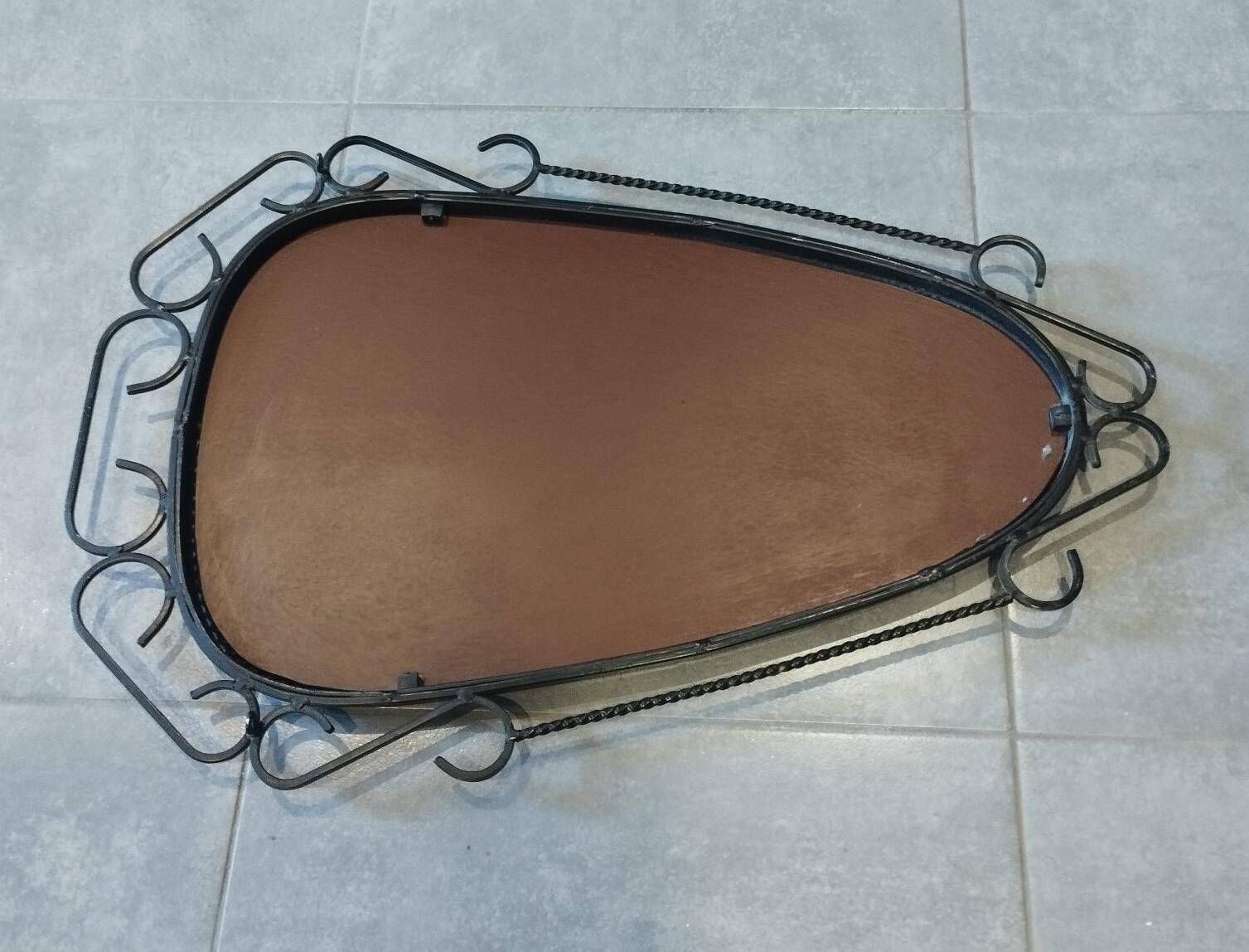 Mid-century modern iron mirror, brutalist, vintage organic, thick sixties.
