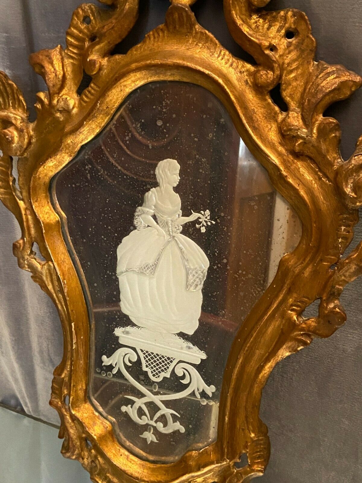 Mirror Rocaille Louis XV gilded wood decorated with a candle display depicting a lady Venice xixth