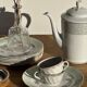 Bavarian porcelain teapot from Germany with blue frieze and flower lid H23