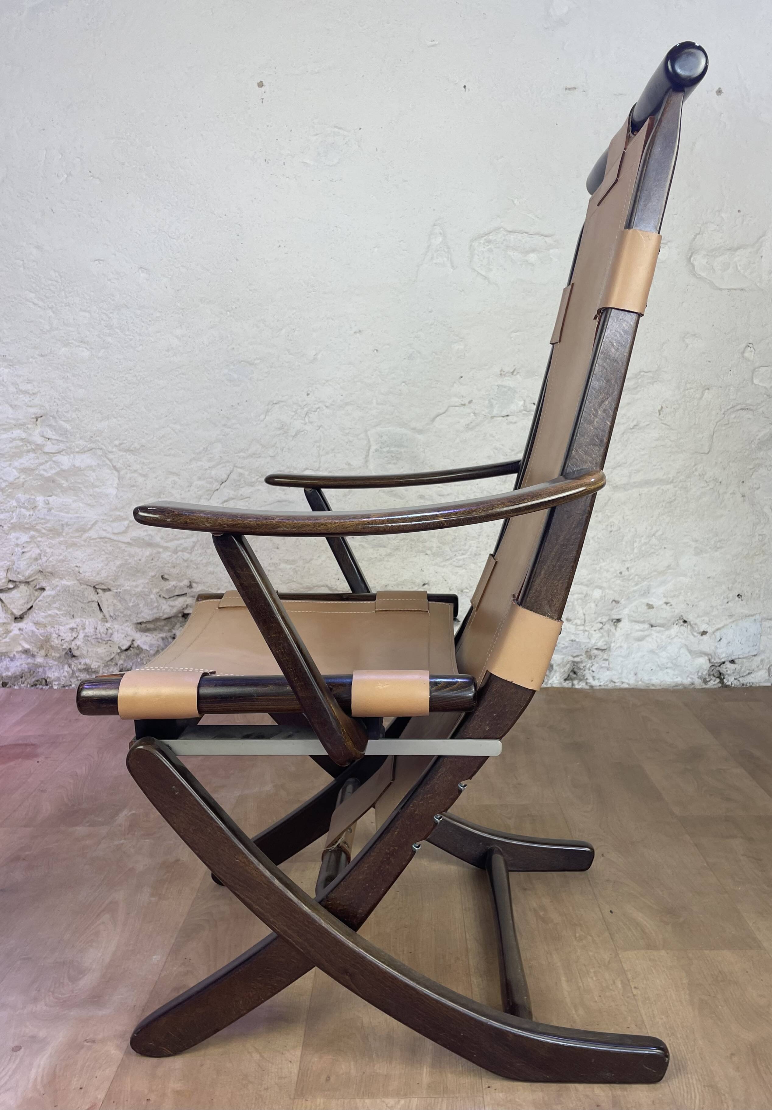 Colonial style leather armchair and ottoman