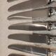 12 silver-plated dessert knives by Christofle Vendôme, 20.3cm