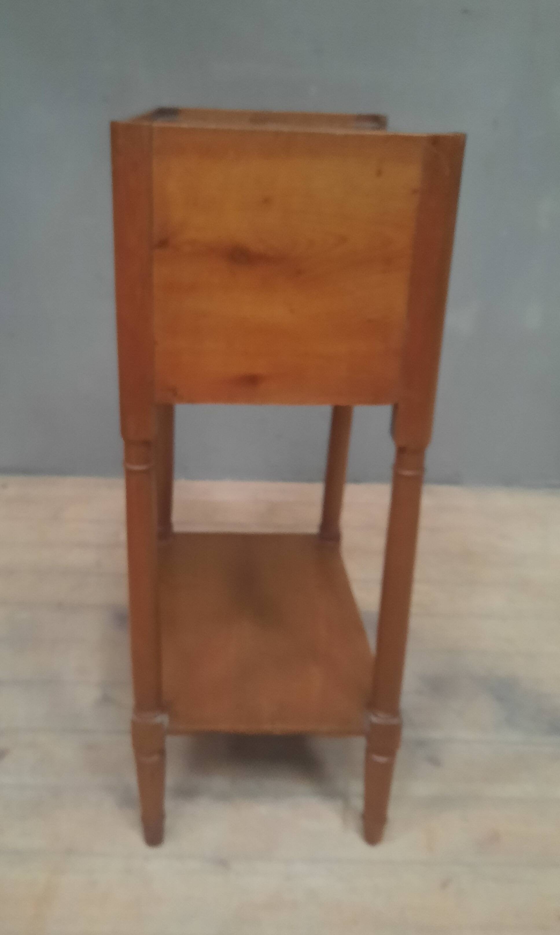 Curtained bedside table from the nineteenth century.