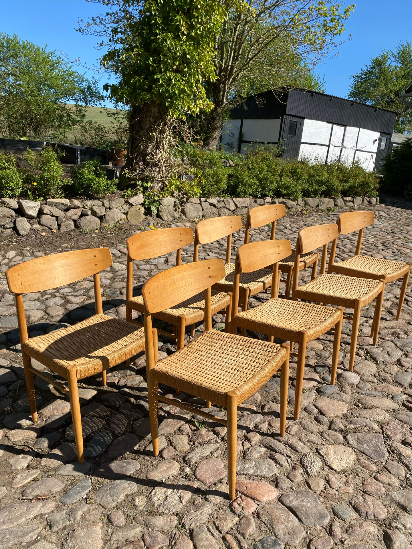 8 dining chairs in oak  w/ paper cord