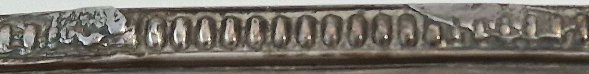 I037 Large shallow antique silver-plated dish in the Louis XVI style with bead decoration.