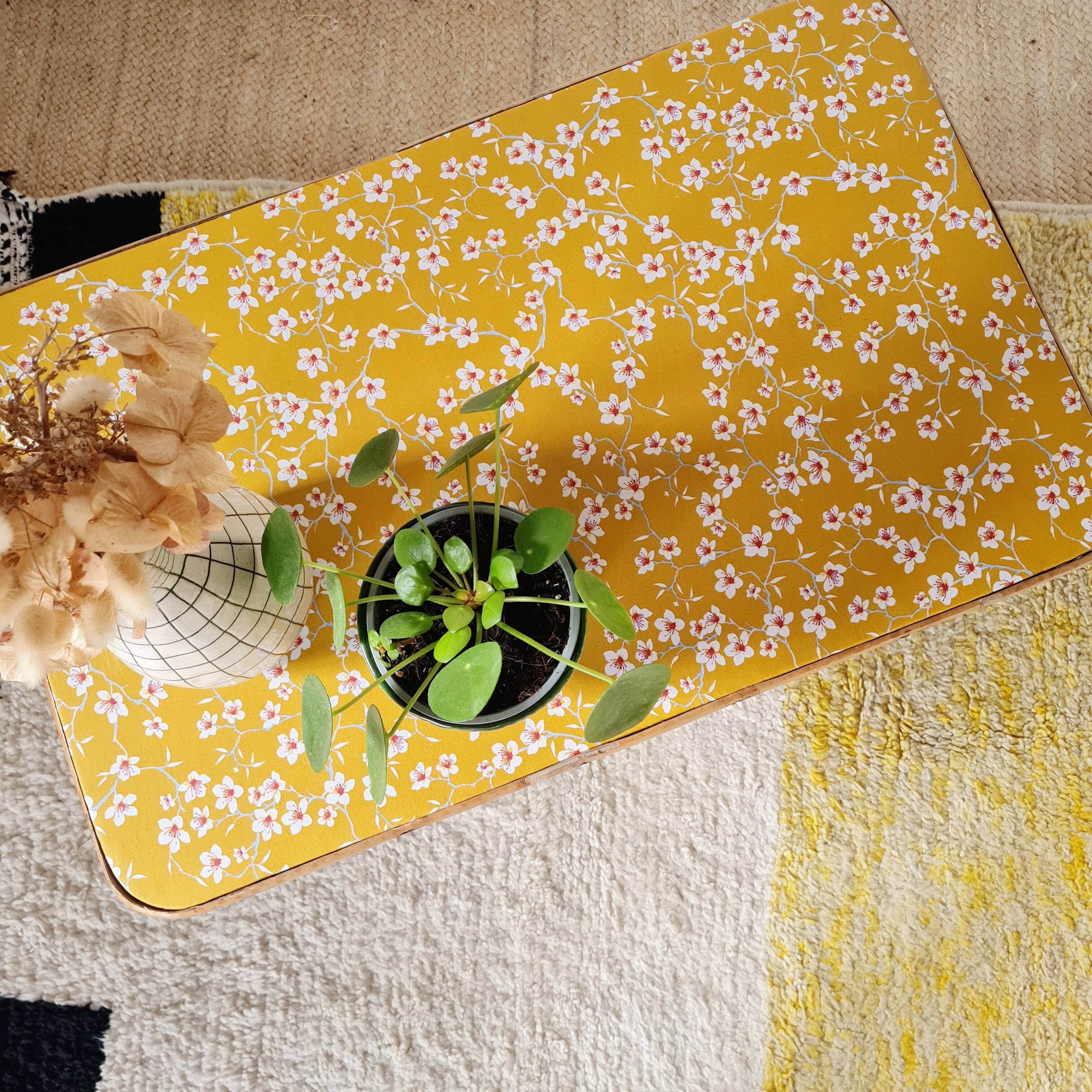 Antique rattan coffee table - yellow floral top