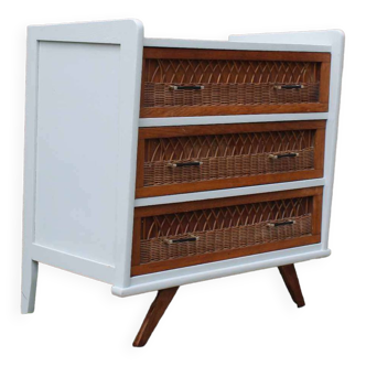 Scandinavian chest of drawers made of wood and rattan