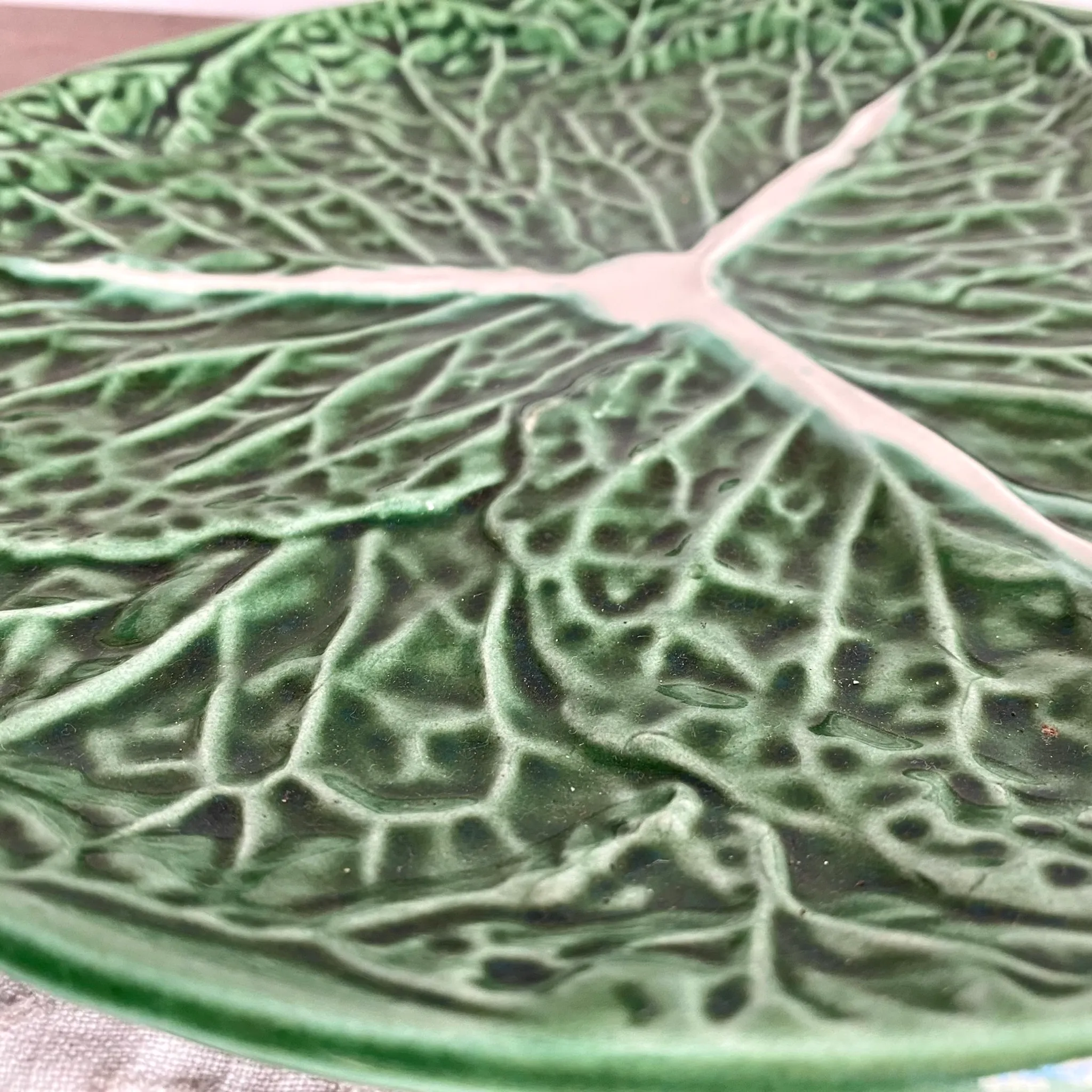 Large soup tureen in earthenware with a cabbage design, along with a dish and spoon.