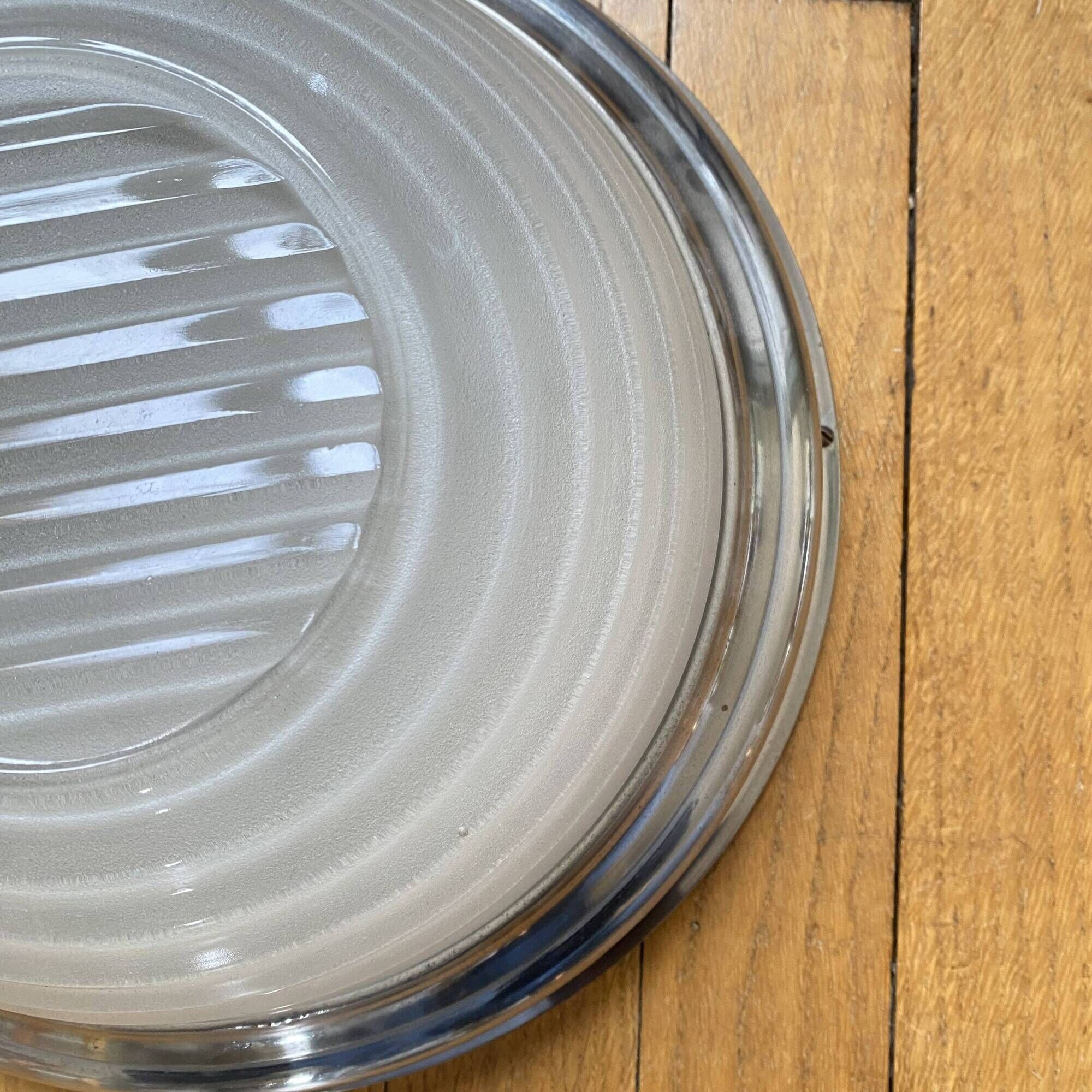 Thick glass ceiling light fixture with a chrome metal support, Holophane type.