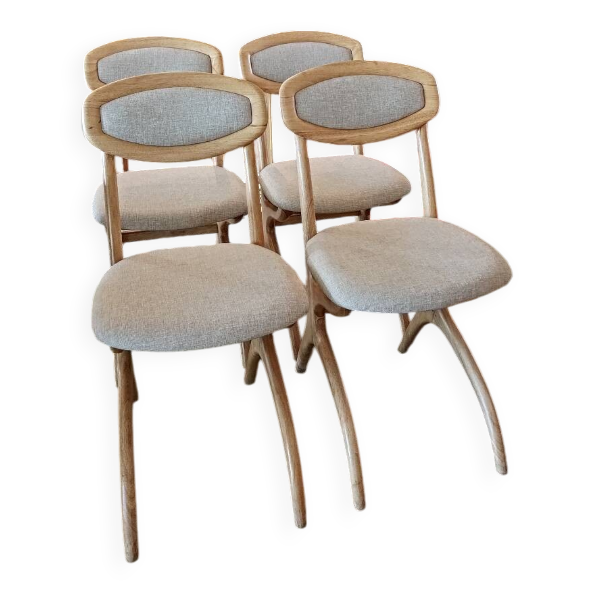 Four Scandinavian-style chairs