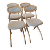 Four Scandinavian-style chairs