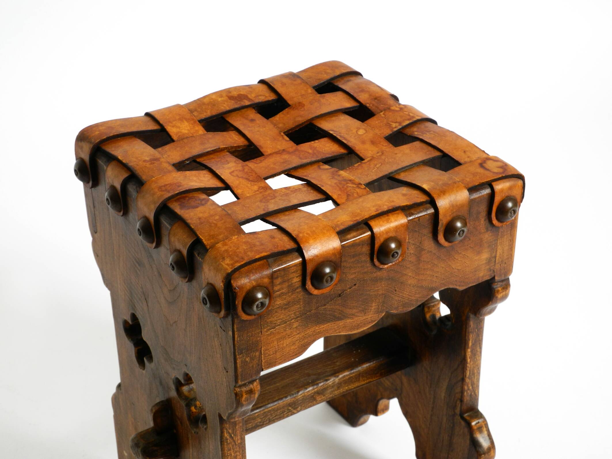 Beautiful 1940s oak stool with a seat made of leather straps