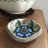 Cup lava foam with blue flower.