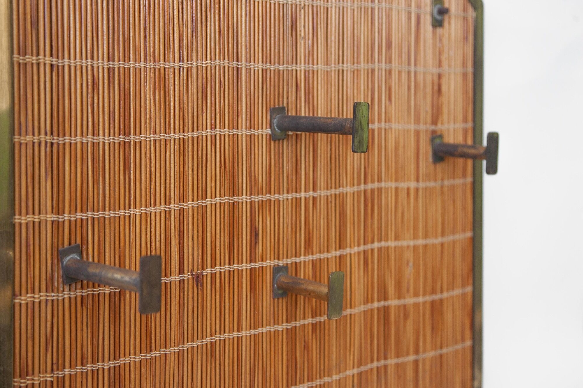 Vintage wicker coat rack with mirror and brass hooks