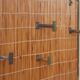 Vintage wicker coat rack with mirror and brass hooks