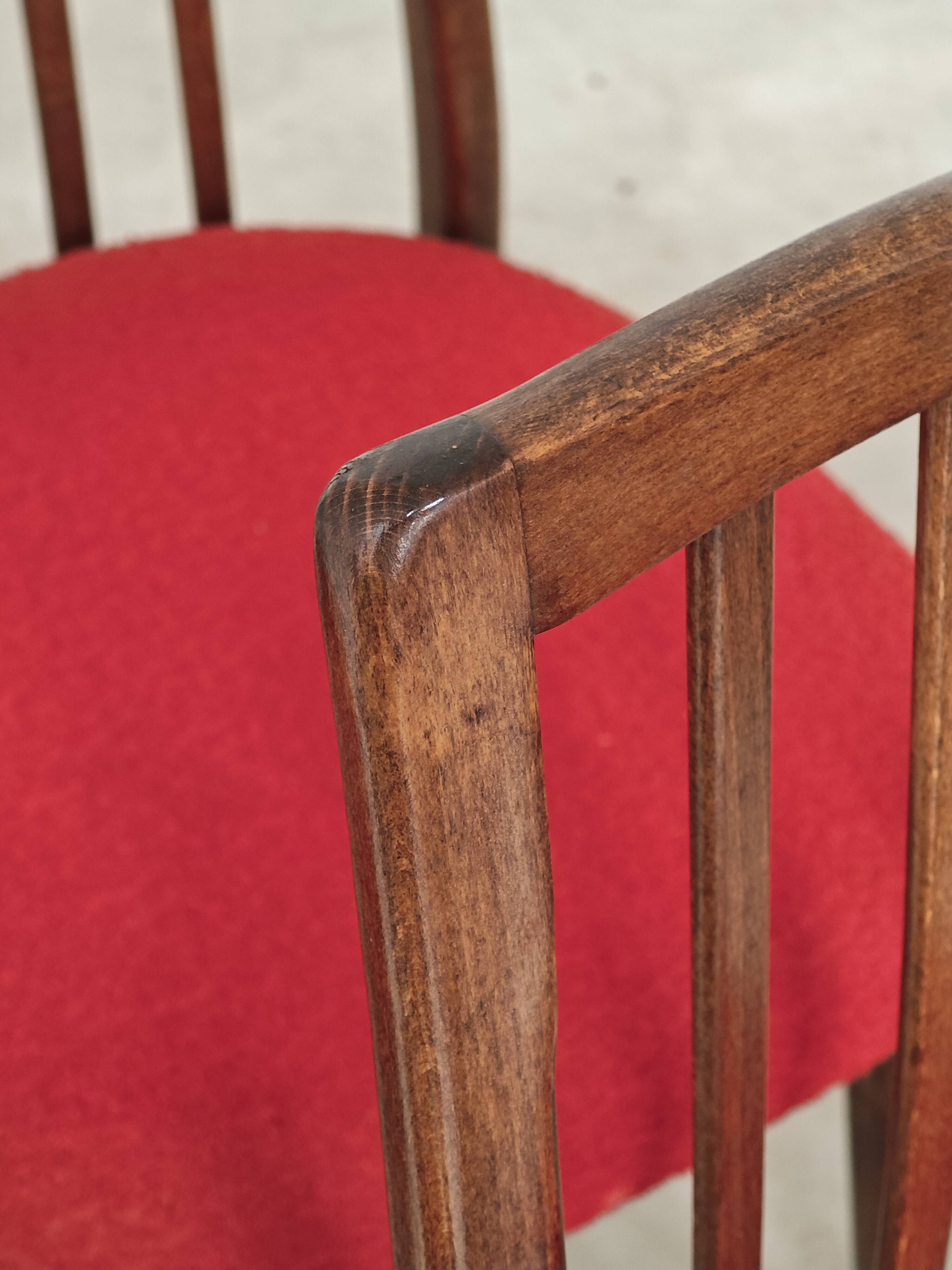 Set of 4 red dining chairs by Antonin Suman for Interier Praha.