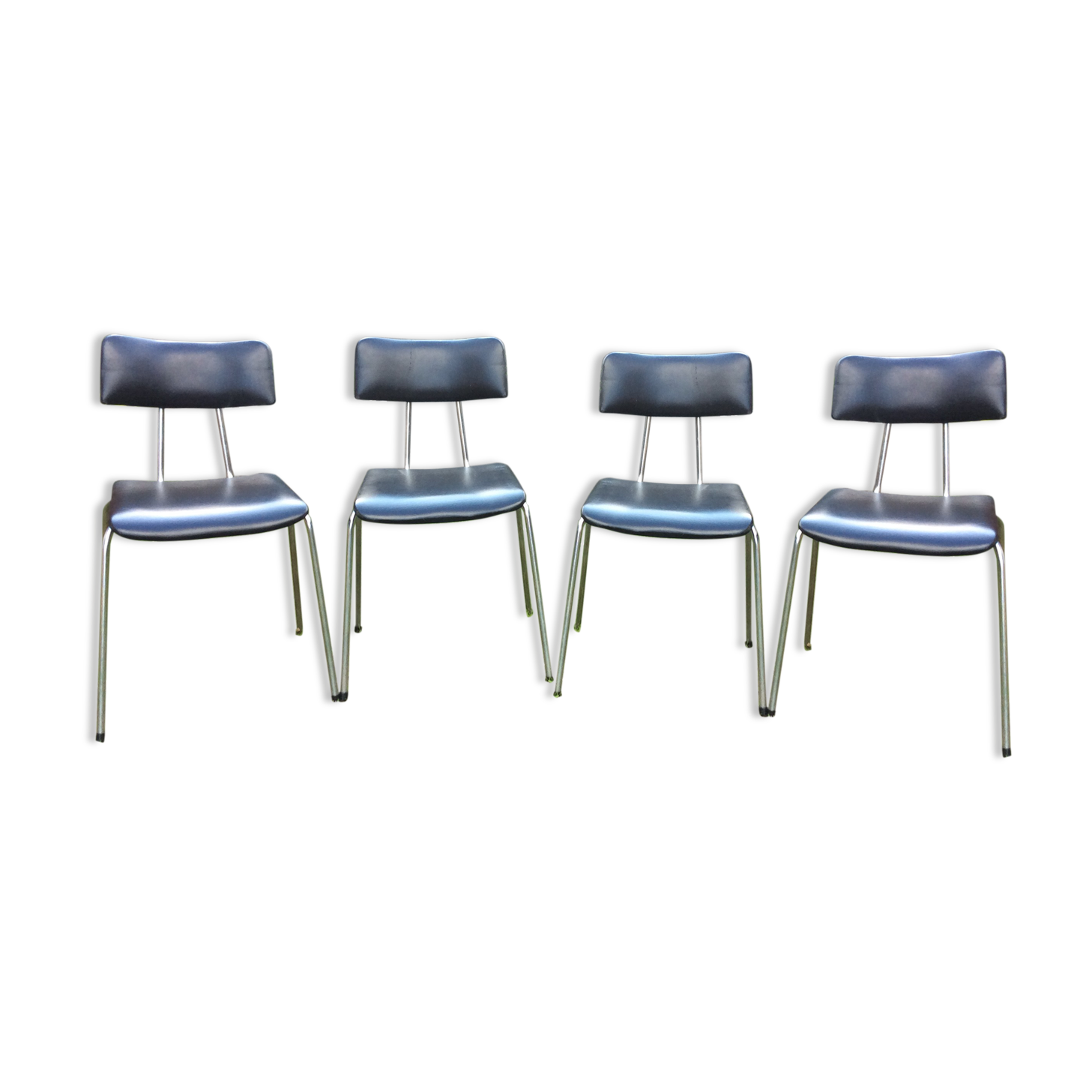 4 Chairs with chrome tubular metal base and black Skaï
