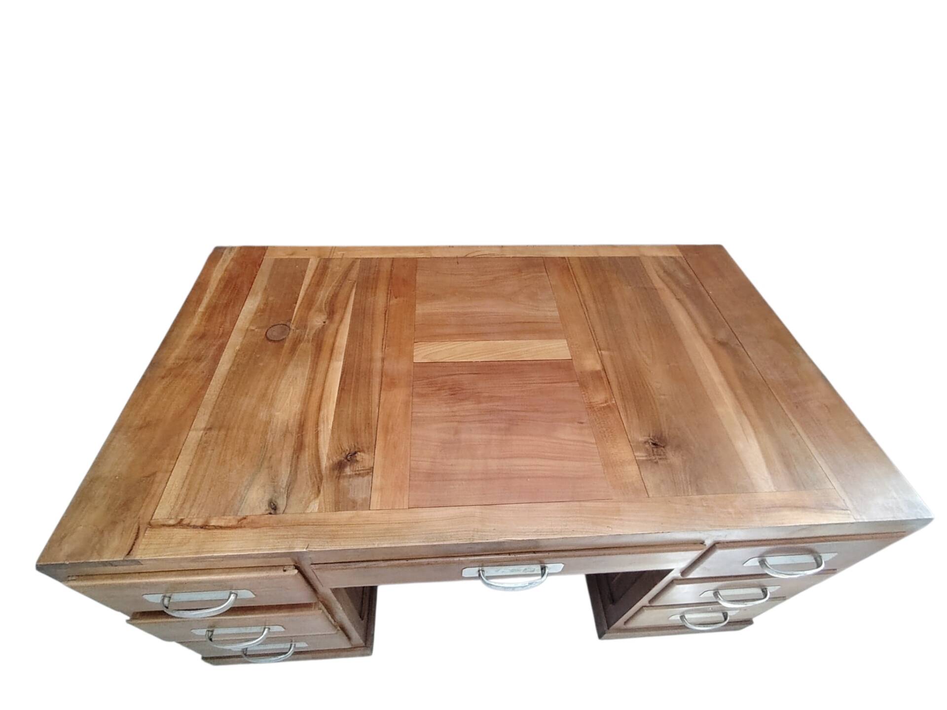 Large modernist minister's desk in solid lemon wood with 7 drawers.