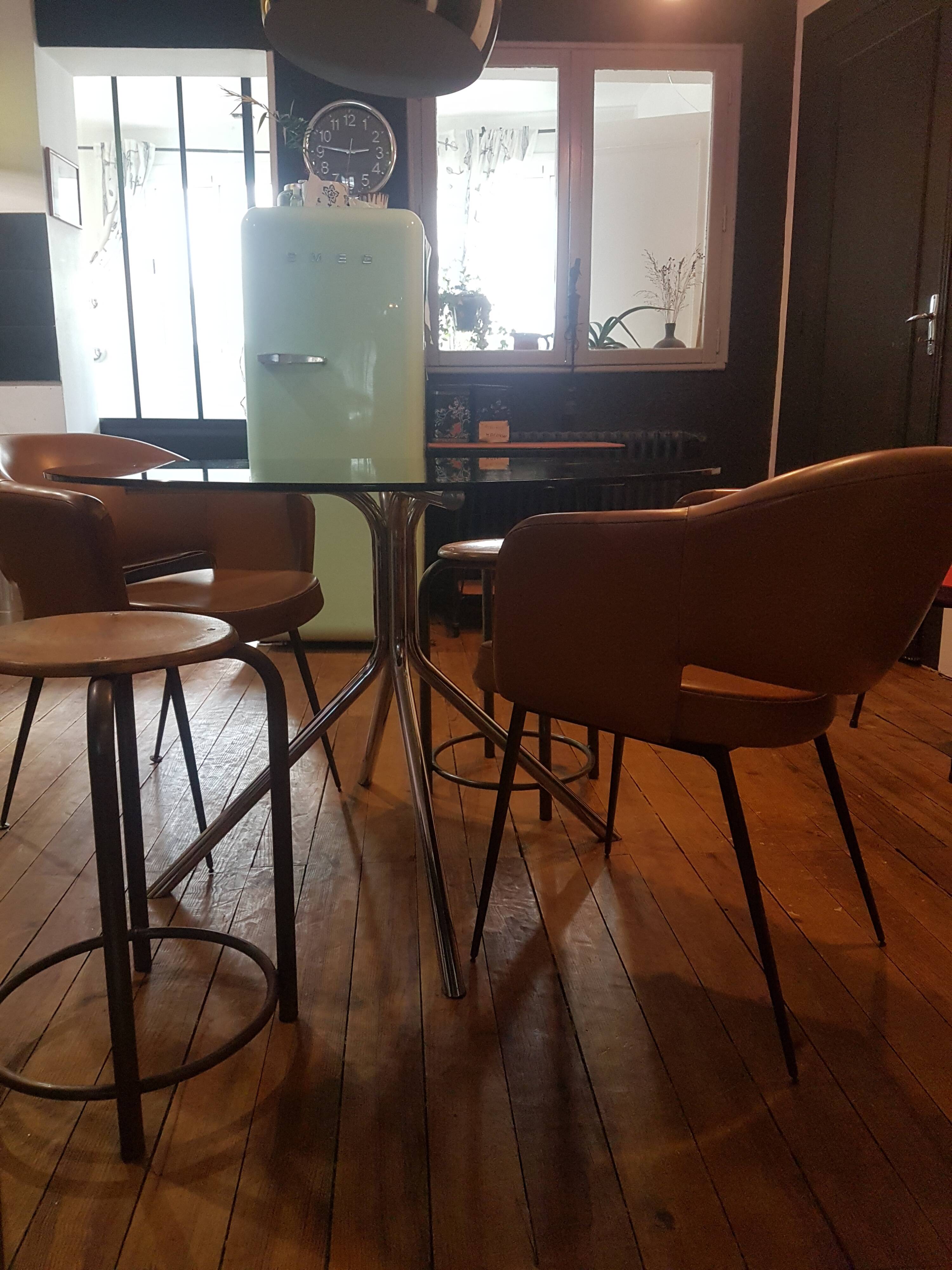 Smoked glass round table and chrome foot