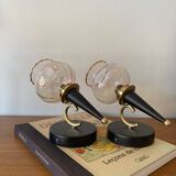 Pair of torch wall lights with iridescent pink glass shades and gold trim.