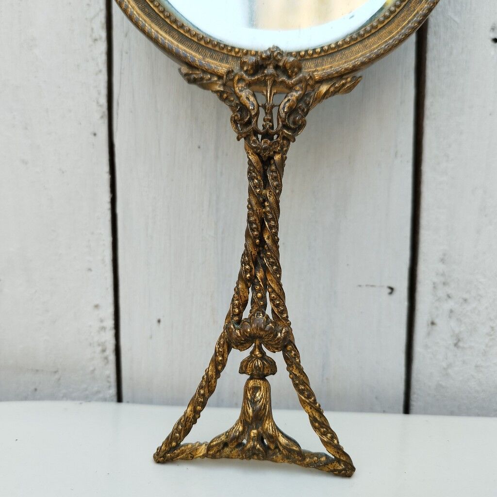 Mirror face to hand gilded bronze knot ribbon