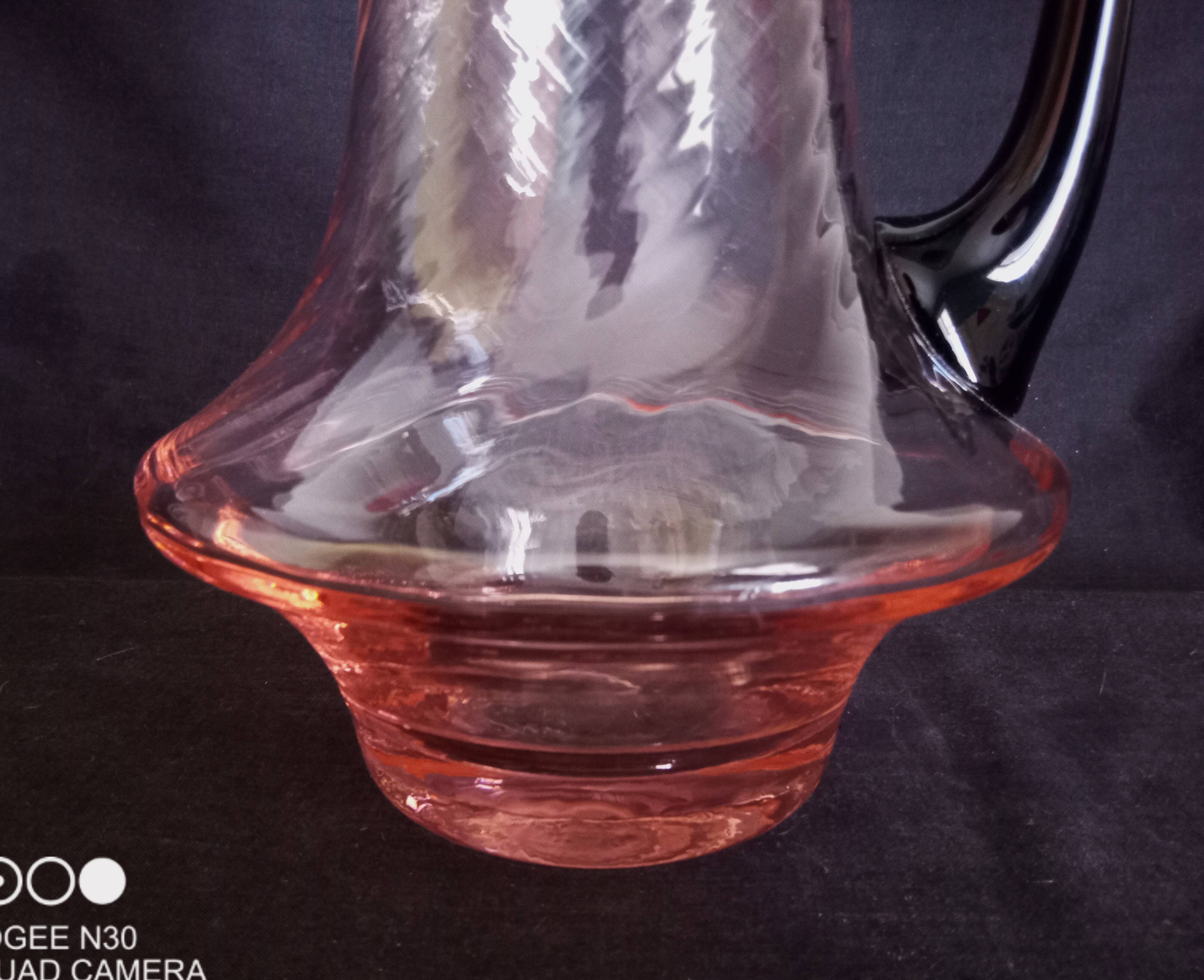 Art Deco orangeade service in pink-orange glass, twisted model.