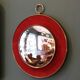 Witch's eye mirror in brass and red velvet