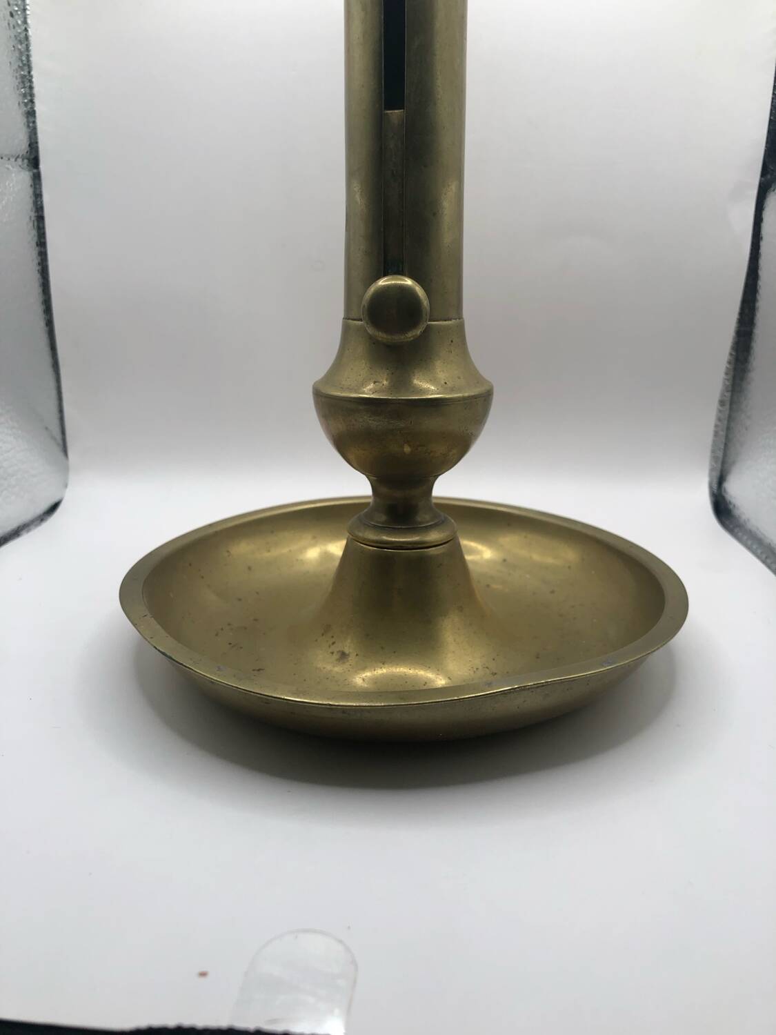 Candle holder with a pusher
