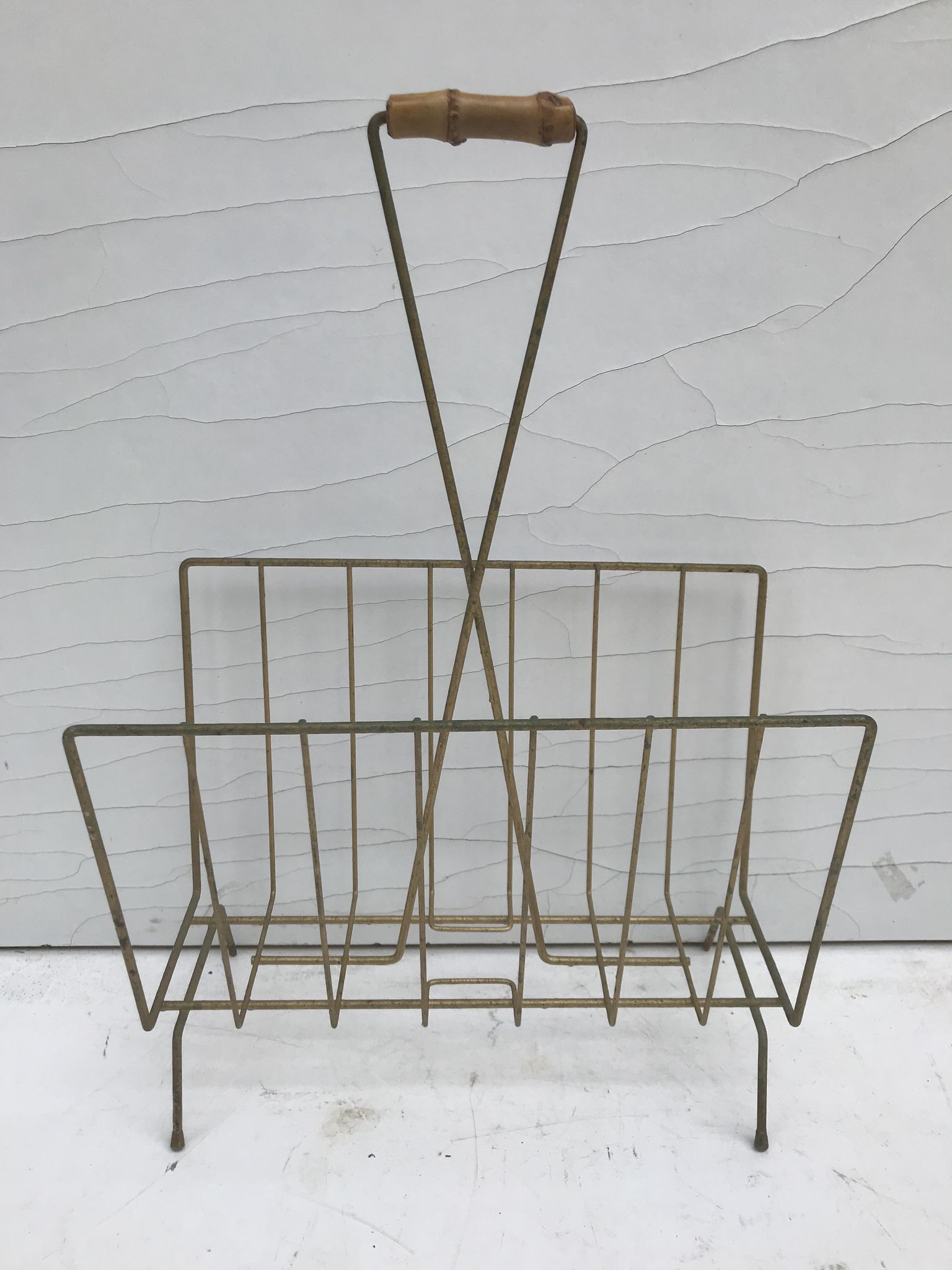 Magazine holder in golden metal and its handle is in bamboo, 1960 vintage