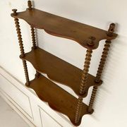 Vintage turned wood wall shelf with 3 levels.