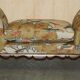 Antique banquette with cluster and ball feet, window seat in Mulberry Flying Ducks fabric.