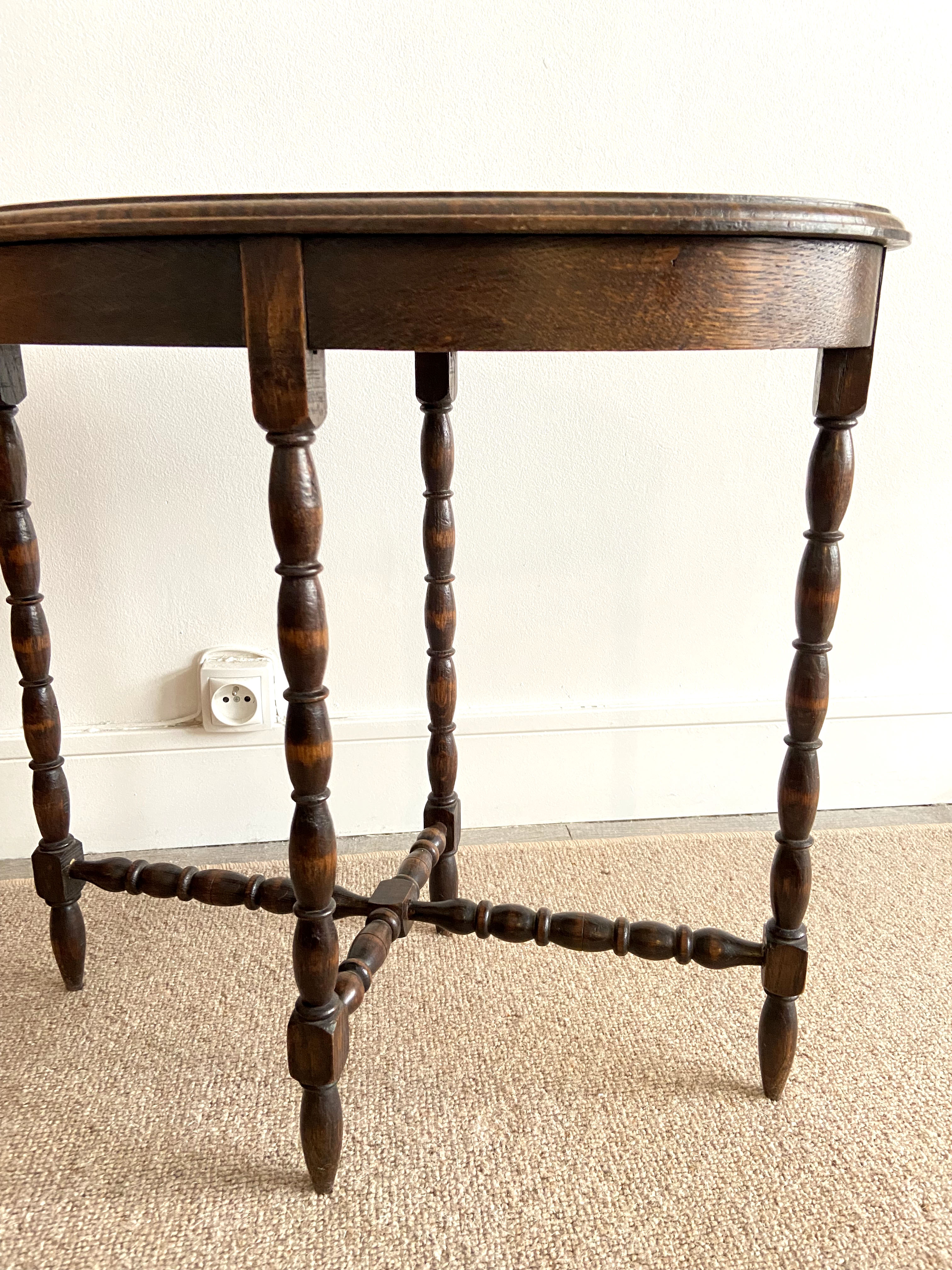 Oval wooden side table turned with spacer