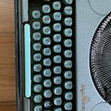 M.J. Rooy light green typewriter