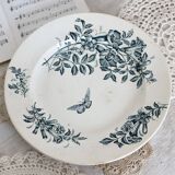 Plat de service rond terre de fer Badonviller modèle Jasmin motif fleuri papillon fin XIXème