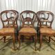 Suite de 6 chaises Louis Philippe en noyer et cannage 19eme