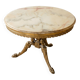 Round marble coffee table with a gold base in classic style.