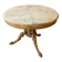 Round marble coffee table with a gold base in classic style.