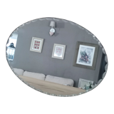 Old beveled oval mirror to pose