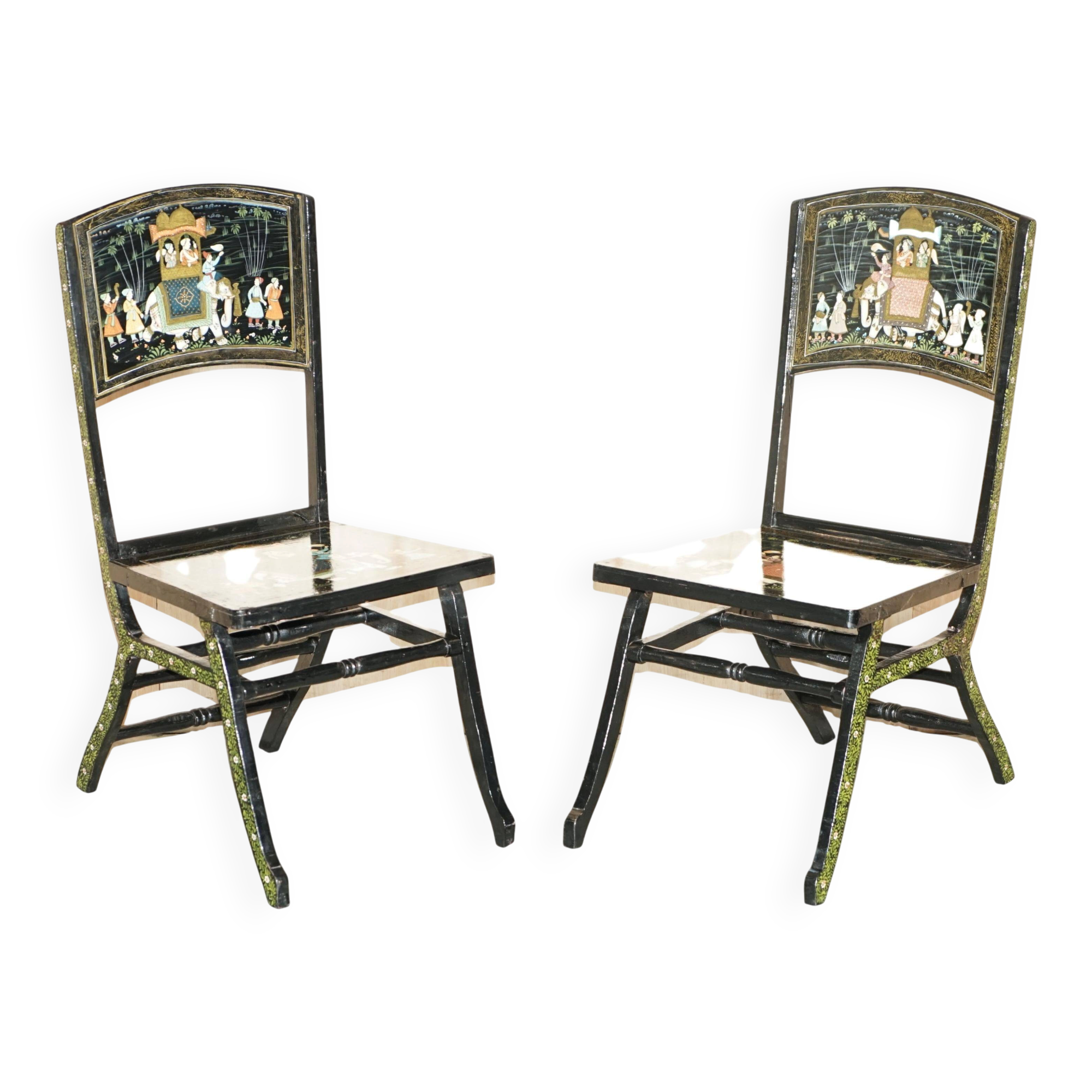 Pair of military folding chairs with Indian decoration.
