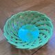 Green woven ceramic basket
