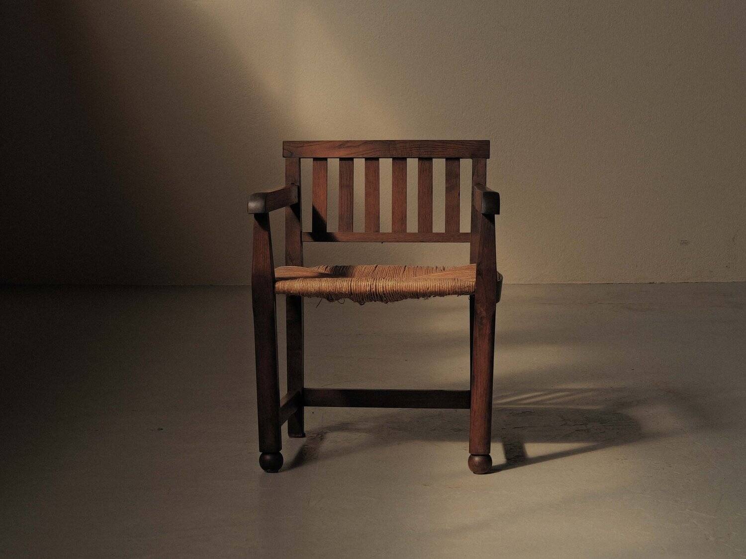 Handcrafted oak and straw armchair, France, circa 1950.